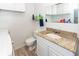 Practical laundry room with white cabinets and granite sink offers storage and utility at 110 Wallace Rd, Goose Creek, SC 29445