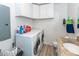 Functional laundry room with modern washer and dryer, plus a convenient utility sink at 110 Wallace Rd, Goose Creek, SC 29445