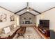 Inviting living room with vaulted ceilings, brick fireplace, ceiling fan, and beautiful area rug at 110 Wallace Rd, Goose Creek, SC 29445