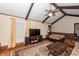 Comfortable living room featuring vaulted ceilings, brick fireplace, and hardwood floors at 110 Wallace Rd, Goose Creek, SC 29445