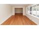 Bright living room boasts gleaming hardwood floors and ample natural light from large windows at 110 Wallace Rd, Goose Creek, SC 29445