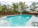 Backyard pool with slide, surrounded by a wooden fence for privacy in a large outdoor living space at 110 Wallace Rd, Goose Creek, SC 29445
