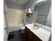 Well-appointed bathroom with combined tub/shower and modern vanity at 1119 Moss Grove Dr, Moncks Corner, SC 29461