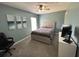 Comfortable bedroom with neutral decor, a ceiling fan and a window letting in natural light at 1119 Moss Grove Dr, Moncks Corner, SC 29461