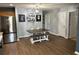 Inviting dining area with a wooden table, a bench, and decor on light blue walls at 1119 Moss Grove Dr, Moncks Corner, SC 29461
