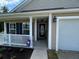Inviting entrance featuring a front porch with a decorative South Carolina flag at 1119 Moss Grove Dr, Moncks Corner, SC 29461