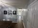 Hallway features smooth wood-look floors and many doors at 1119 Moss Grove Dr, Moncks Corner, SC 29461