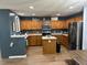 The well-equipped kitchen offers stainless steel appliances, wooden cabinets, and a center island at 1119 Moss Grove Dr, Moncks Corner, SC 29461