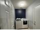 The laundry room offers a modern washer and dryer set at 1119 Moss Grove Dr, Moncks Corner, SC 29461