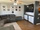 Comfortable living space with a gray sofa, TV, and open layout at 1119 Moss Grove Dr, Moncks Corner, SC 29461