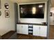 Modern living room with a large television, built-in storage, and sectional sofa at 1119 Moss Grove Dr, Moncks Corner, SC 29461