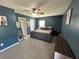 Comfortable bedroom with two windows, a fan, a bed, and a dresser at 1119 Moss Grove Dr, Moncks Corner, SC 29461