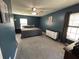 Comfortable bedroom with two windows, a fan, a bed, and a dresser at 1119 Moss Grove Dr, Moncks Corner, SC 29461
