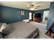 Comfortable bedroom with two windows, a fan, a bed, and a dresser at 1119 Moss Grove Dr, Moncks Corner, SC 29461