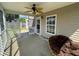 A screened-in patio provides a relaxing outdoor space with a cushioned chair at 1119 Moss Grove Dr, Moncks Corner, SC 29461