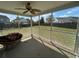 Screened-in patio with cushioned seating and a view of the expansive backyard at 1119 Moss Grove Dr, Moncks Corner, SC 29461