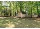 Well-shaded private backyard with storage shed and mature trees at 115 White Blvd, Summerville, SC 29483