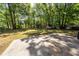 Large and private backyard with mature trees and storage shed at 115 White Blvd, Summerville, SC 29483