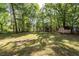 Backyard features mature trees, storage shed, and lots of privacy at 115 White Blvd, Summerville, SC 29483