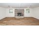 Basement featuring a brick fireplace, new flooring, and recessed lighting at 115 White Blvd, Summerville, SC 29483