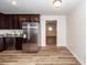 Bright kitchen featuring stainless steel refrigerator and dark cabinets at 115 White Blvd, Summerville, SC 29483
