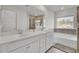 Bathroom featuring double sink vanity, soaking tub, and glass shower stall providing a luxurious experience at 116 Slater Lake Ln, Summerville, SC 29483
