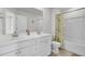 Bright bathroom featuring a double vanity, a shower with lemon-themed curtain and a toilet at 116 Slater Lake Ln, Summerville, SC 29483