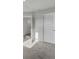 Sunlit bedroom showcasing neutral carpet and crisp white doors, creating a serene retreat at 116 Slater Lake Ln, Summerville, SC 29483