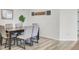Formal dining room featuring modern decor, hardwood flooring, and ample seating at 116 Slater Lake Ln, Summerville, SC 29483