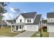 Attractive two-story home with a modern facade, attached garage, and well-kept front yard at 116 Slater Lake Ln, Summerville, SC 29483