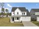 Charming two-story home featuring a modern exterior, attached garage, and well-maintained landscaping at 116 Slater Lake Ln, Summerville, SC 29483