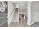 Inviting foyer featuring a staircase, hardwood floors, and an open view of the living spaces at 116 Slater Lake Ln, Summerville, SC 29483