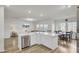 Open concept kitchen with a bar and seating area, stainless steel appliances, and hardwood floors at 116 Slater Lake Ln, Summerville, SC 29483