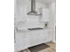 Modern kitchen with stainless steel vent hood and gas cooktop at 116 Slater Lake Ln, Summerville, SC 29483
