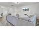 Open concept living room with gray sofa, hardwood floors, and modern decor at 116 Slater Lake Ln, Summerville, SC 29483