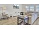 Bright living room featuring hardwood floors, neutral paint, and a comfortable sofa at 116 Slater Lake Ln, Summerville, SC 29483