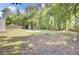 Over 1/2 acre backyard with a well-maintained lawn, and mature trees at the property line at 116 Trestlewood Dr, Summerville, SC 29486