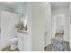 Hallway view of a bathroom featuring a shower, sink with granite countertop, and coastal decorations at 116 Trestlewood Dr, Summerville, SC 29486