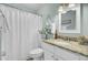 Cozy bathroom featuring granite countertops, white cabinetry, and coastal-themed decor at 116 Trestlewood Dr, Summerville, SC 29486