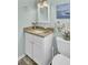 Cozy bathroom featuring granite countertops, white cabinetry, and coastal-themed decor at 116 Trestlewood Dr, Summerville, SC 29486