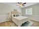 Serene bedroom with a tufted headboard, soft lighting, and tasteful decor, creating a relaxing retreat at 116 Trestlewood Dr, Summerville, SC 29486