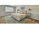 Comfortable bedroom features a patterned headboard, decorative pillows, and a vibrant area rug at 116 Trestlewood Dr, Summerville, SC 29486