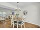 Inviting dining area with wood floors, stylish lighting, and comfortable seating offers a relaxed dining experience at 116 Trestlewood Dr, Summerville, SC 29486