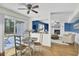 Bright dining area with deck access and a view into a living room offers seamless indoor-outdoor living at 116 Trestlewood Dr, Summerville, SC 29486