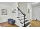 Welcoming entryway with hardwood floors, stairs, and beach-themed decorations at 116 Trestlewood Dr, Summerville, SC 29486