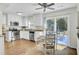 Open kitchen and dining area with stainless steel appliances, white cabinets, and outdoor access offer a perfect blend of indoor-outdoor living at 116 Trestlewood Dr, Summerville, SC 29486