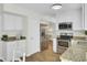Bright kitchen with stainless steel appliances, granite countertops, and ample cabinet space provides a chef's haven at 116 Trestlewood Dr, Summerville, SC 29486