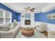 Inviting living room featuring a cozy fireplace, comfortable seating, and hardwood floors at 116 Trestlewood Dr, Summerville, SC 29486