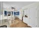 Open-concept living space with blue accent wall, dining area, and kitchen provides a seamless flow for entertaining and everyday living at 116 Trestlewood Dr, Summerville, SC 29486