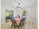 Bright dining area with hardwood floors and a view to the living room with comfortable sofa at 1211 Eastwood Ave, Hanahan, SC 29410